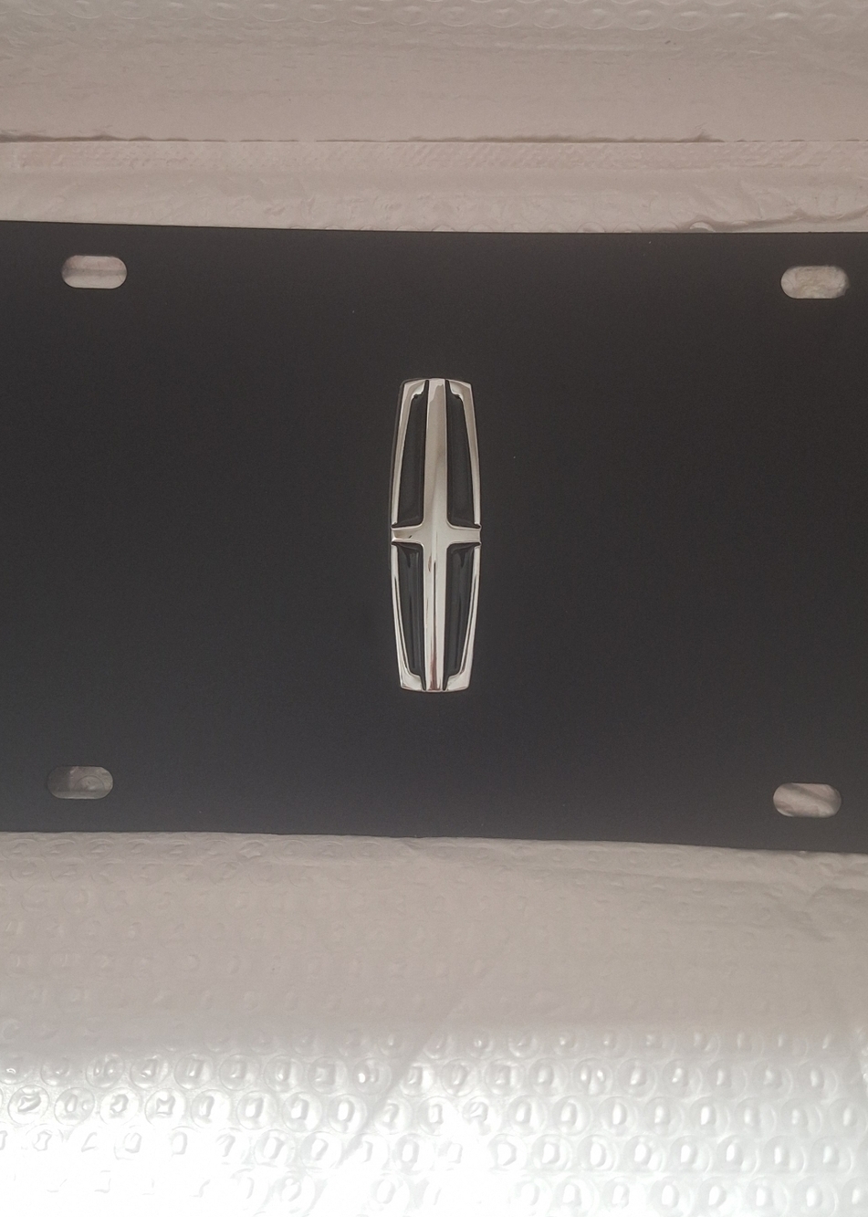 Lincoln Flat Black License Plate With Chrome 3D Logo.